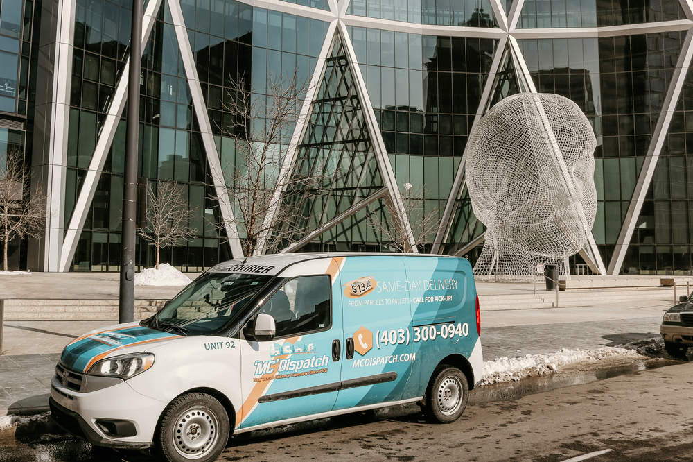 Our company van making delivery shipment to Wonderland sculpture, Bow Tower, Calgary